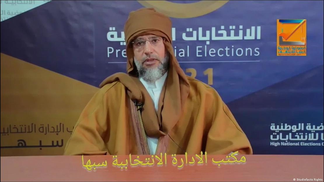 ގައްޒާފީގެ ދަރިކަލުން ސައިފުލް އިސްލާމް ގެ ގަޔަށް ބަޑިޖަހައި އަވަހާރަކޮށްލައިފި 